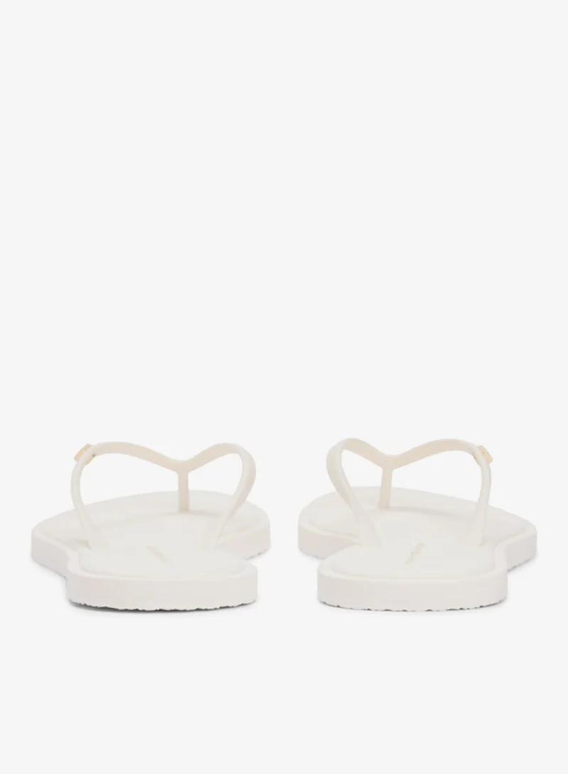 TOMMY HILFIGER  Chic Enamel Flag Flip-Flops for Women | Best Price UAE